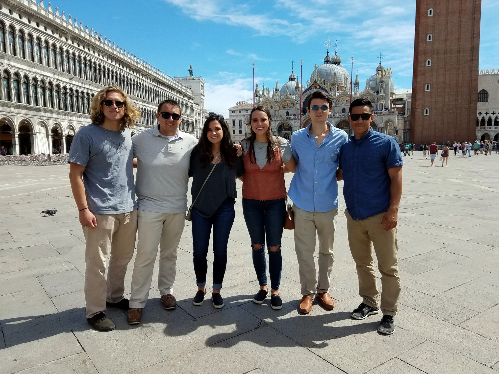 SPEA students studying abroad standing in a plaza in Venice.