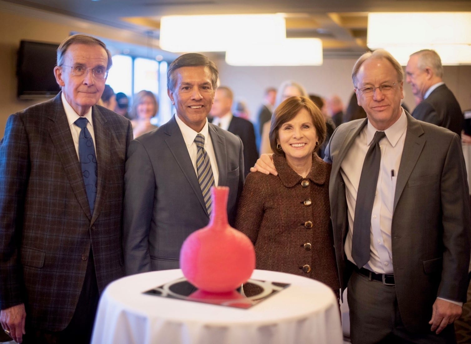 Moira Carlsted stands with the John L. Krauss award--a handmade glass sculpture from local artist Ben Johnson--at the O'Neill School's Champions of Public Policy event. Carlstedt is pictured below (L-R) with John Krauss, PPI director Thomas Guevara, and Brain Payne, President and CEO of the Central Indiana Community Foundation.