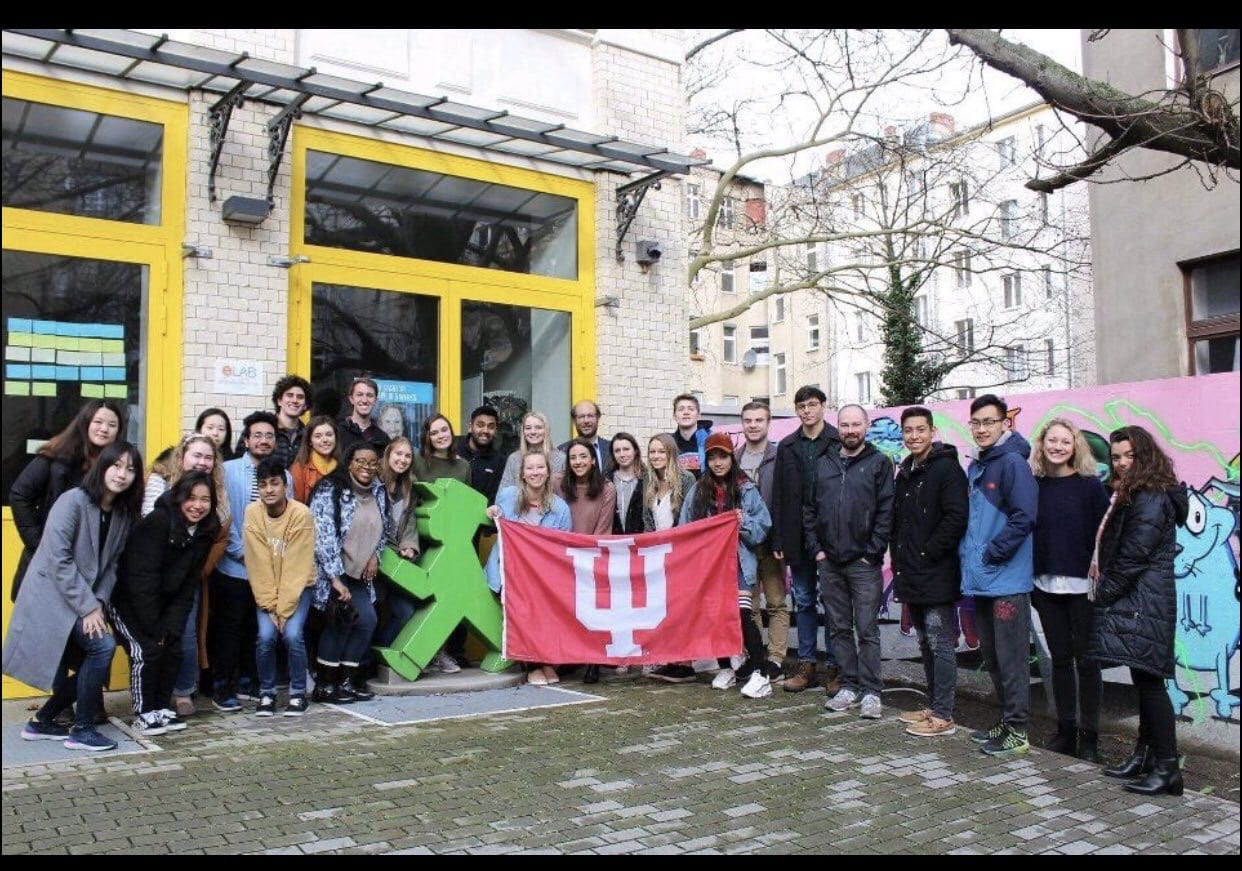 Group of students pose with IU flag in Berlin