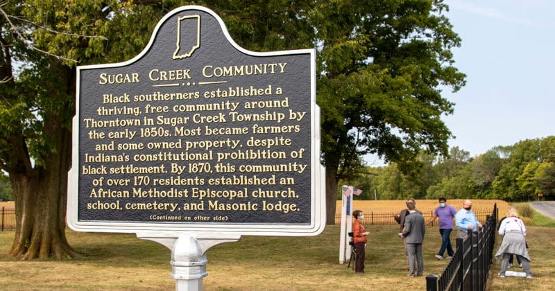 Historical sign that gives history of Sugar Creek Community