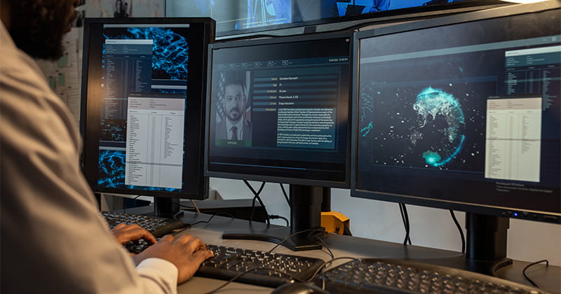 Computer screens showing information about a person in an investigation 